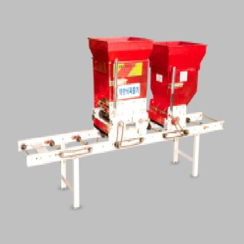 Manual chain roller type sower with scattering double container